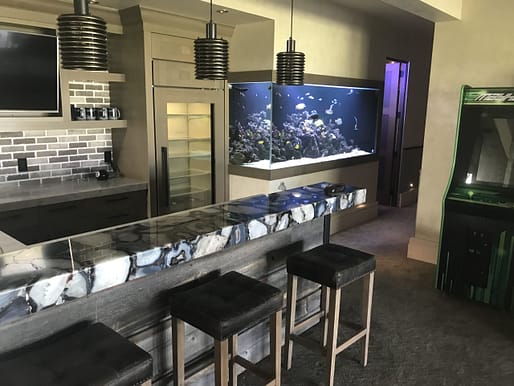 clients custom aquarium in the den